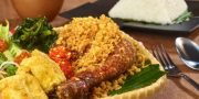 Ayam Penyet with Rice served in dish isolated on table top view of thai food