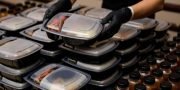 Lunch box with food in the hands. Catering